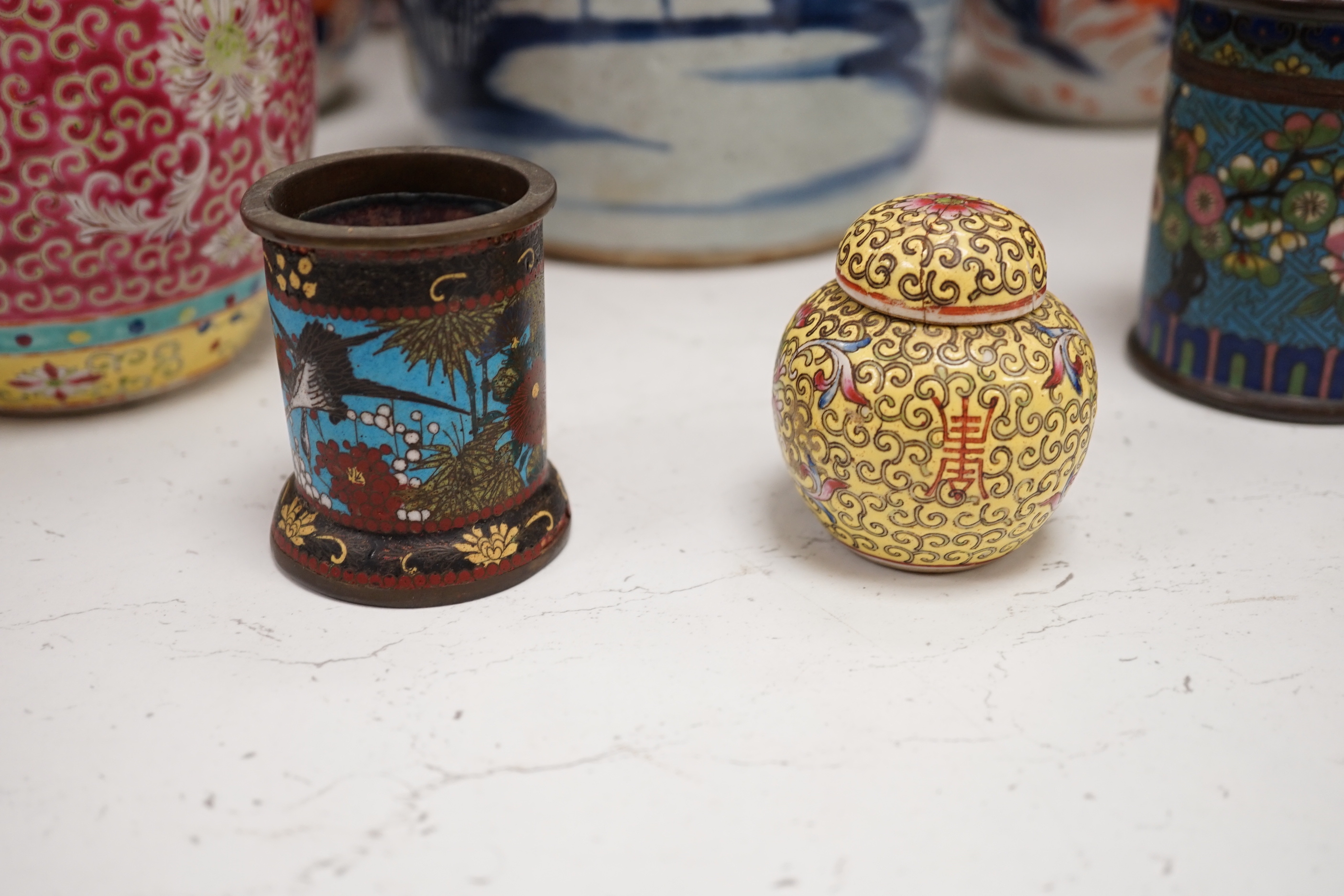 A collection of 20th century Chinese and Japanese ceramics including pair of Imari bottle neck vases, blue and white jar and cover and a pair of dog of foo pots and covers (one cover missing) together with two cloisonné